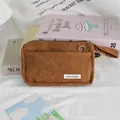 Detailed view of brown corduroy pencil case with soft ribbed texture and zipper. - 19*5*12cm / Brown