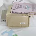Detailed macro view of a khaki corduroy pencil case with a May Rabbit label tag. - 19*5*12cm / Apricot