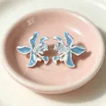 Vintage style blue orchid stud earrings with clear gemstone detail in pink dish - 2606197 Blue Flower Zirconia Stud Earrings