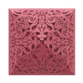 Detailed view of intricate laser-cut lace pattern on burgundy invitation cover - Burgundy