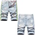 Light blue distressed denim shorts for men with paint splatters and neon side stripes - EU 38 / Light Blue Distressed Ripped (703# Tech)