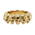 Vista detallada de anillo retro de acero de titanio dorado con múltiples calaveras. - US 7 / Dorado
