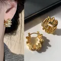 Elegant 18k gold plated hoop earrings featuring a unique textured wavy design with 925 silver needles - 925 Silver Needle Wave Texture C-Shaped Hoops