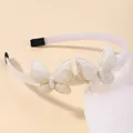 Elegante cerchietto con farfalle color crema per bambine con dettagli di perle bianche. - Bianco avorio