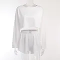 Minimalist white hollow-out two-piece pajama set with long sleeve crop top and shorts - S / White