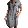 Close-up view of a gray short sleeve denim shirt dress with button-down front and pockets - S / Gray