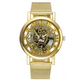 Detailed close-up of a stylish gold-toned skeleton quartz watch with a mesh strap. - Gold