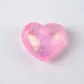 Detalle de un juguete antiestrés con forma de corazón rosa y purpurina de colores. - Bolsa OPP / Corazón de Lentejuelas Rosas