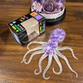 Transparant octopus-knijpspeeltje met paarse kralen voor stressverlichting op tafel - Paarse kralen