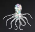 Jouet de décompression pieuvre souple et transparent rempli de perles macaron colorées - Perles Colorées
