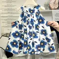 Girls sleeveless summer dress featuring an artistic blue floral print and a wide hem - 80cm / White Blue Flower Print (QZ07)