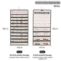 Dual-sided hanging jewelry organizer with 48 clear pockets for earrings and necklaces - White (48 Grids)
