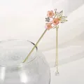 Elegant gold Chinese hair stick featuring pink peach blossoms and pearl tassels - Butterfly Peach Blossom Pink