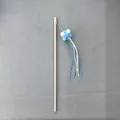 Interactive wooden cat teaser wand featuring blue and white plush balls and tassels - White And Blue Suede Pom-pom Cat Toy