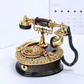 Vintage style telephone music box with golden accents and decorative rose carvings - Heart-shaped Telephone Music Box Brown