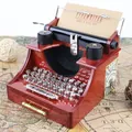 Decorative retro vintage typewriter music box with wood grain finish and moving keys - 2021 Typewriter Music Box