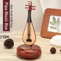 Traditional Chinese Pipa shaped music box featuring elegant wood grain finish and base - 2051 Pipa Music Box