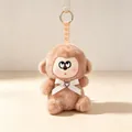 Adorable brown plush monkey keychain featuring a white lace bow and heart charm accessory - Monkey