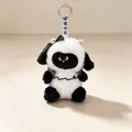 Close-up of cute black and white panda plush keychain with bow detail - Lamb