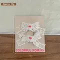 Korean style white lace bow hair clips for baby girls on light pink display card - 2 Pcs/Set / Pink Beaded Style