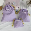 Set of three purple Oxford cloth drawstring pouches for cosmetic storage and organizing - Three-Piece Set / Purple