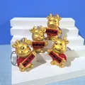 Set di 4 simpatici portachiavi a forma di bue dorato con pergamene rosse festive - Bue Dorato 1