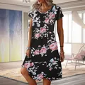 Full-length view of a summer floral print dress with a casual round neck and loose fit - S / Black With Red Flowers