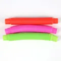 Kleurrijke sensorische poptubes in rood, roze en groen voor stressverlichting. - Pop Tube Speelgoed
