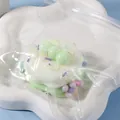 Soft pastel green silicone stress relief squishy toy in piggy milk cake design - Green Grape Soy Milk Squishy