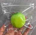 Green fruit-shaped silicone squeeze decompression toy in a clear plastic zip bag - Fluid Green Plum Durable