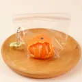 Realistic orange-shaped silicone squishy stress relief toy inside a clear zip bag - Peeled Orange - Orange