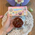 Soft chocolate cookie shaped decompression squeeze toy with colorful sprinkles in packaging - Emoji Sandwich Cookie Squishy (Chocolate)