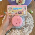 Super soft pink cookie silicone squishy decompression toy shown in its original packaging - Emoji Sandwich Cookie Squishy (Pink)