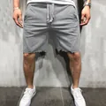 Premium men's grey sports fitness shorts featuring a casual frayed hem and drawstring - S / Bottoms / Dark Gray