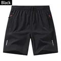 Pantaloncini sportivi neri da uomo a asciugatura rapida con coulisse e tasche con zip - 3XL / Pantaloni e gonne / Nero