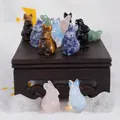 Macro view of hand-carved natural crystal rabbit figurines in assorted gemstones - Multicolor