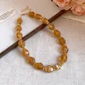 Detailed close-up of a vintage amber acrylic necklace with colorful glaze effect - 63# Necklace / Light Coffee
