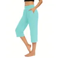 Detailansicht hellblaue Damen-Caprihose mit praktischen Seitentaschen für den Sport - S / Smaragd