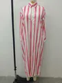 Front view of a loose pink and white striped long-sleeved shirt dress on a mannequin. - S / Tops / Pink
