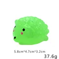Detailweergave van een groene glitter egel squishy toy met afmetingen en gewicht - Groene Egelt
