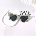 Stylish mint green heart-shaped sunglasses for women featuring chic dark tinted lenses - Mint Green
