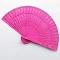 Detailed view of magenta hollowed-out wooden folding fan for wedding dance gift - 20cm / Rose Red