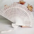 Elegant white hollow carved wooden folding fan with decorative tassel for wedding gift - Hollow Wood Fan (With Tassel) / White