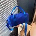 Vibrant blue cylindrical sports duffel bag with wide shoulder strap for gym or travel. - Blue / Small