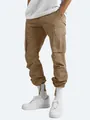 Detail shot of men's khaki cargo pants with side pockets and drawstring cuffs - S / Bottoms / Khaki