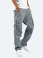 Detailed view of men's casual grey cargo pants featuring large side pockets and drawstring hem - S / Bottoms / Gray