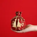 Traditional Chinese red velvet wedding candy bag with gold floral patterns and tassels - Sakura Red