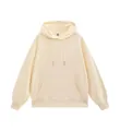 Plain oversized cream-colored hooded sweatshirt featuring a front kangaroo pocket and drawstrings - XS / Tops / Beige Apricot