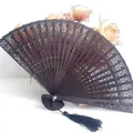 Elegant dark brown hollow-out wooden folding fan with black tassel for wedding dance - Hollow Wood Fan (With Tassel) / Black