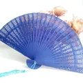 Exquisite blue hollowed-out wooden folding fan with light blue tassel for wedding gifts - Blue